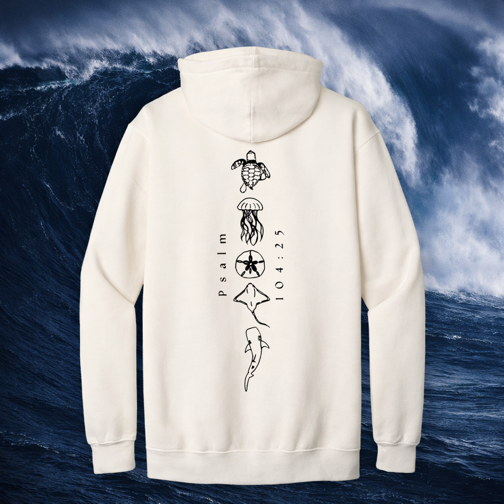 White hoodie with black graphics and Christian text on a background of blue ocean waves