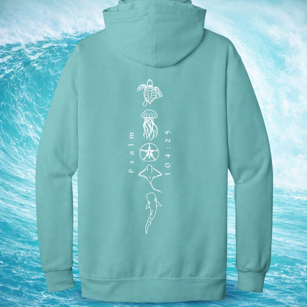 Teal hoodie with ocean-themed Christian designs on the back against a blue water background