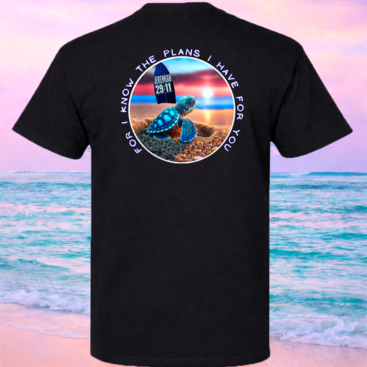 Black t-shirt with a turtle graphic and Jeremiah 29:11 text on a beach background