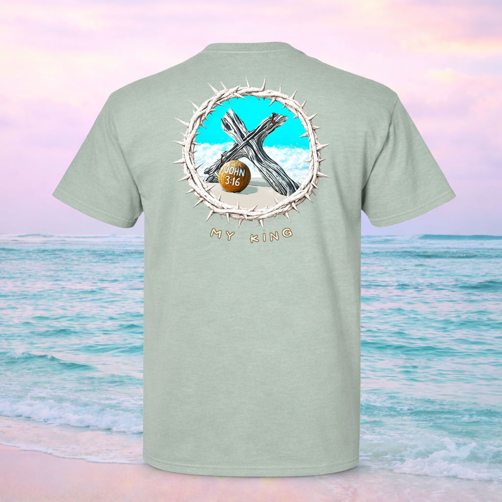 Light green t-shirt with a graphic design on the back, featuring a cross and 'My King' text, against a beach background.