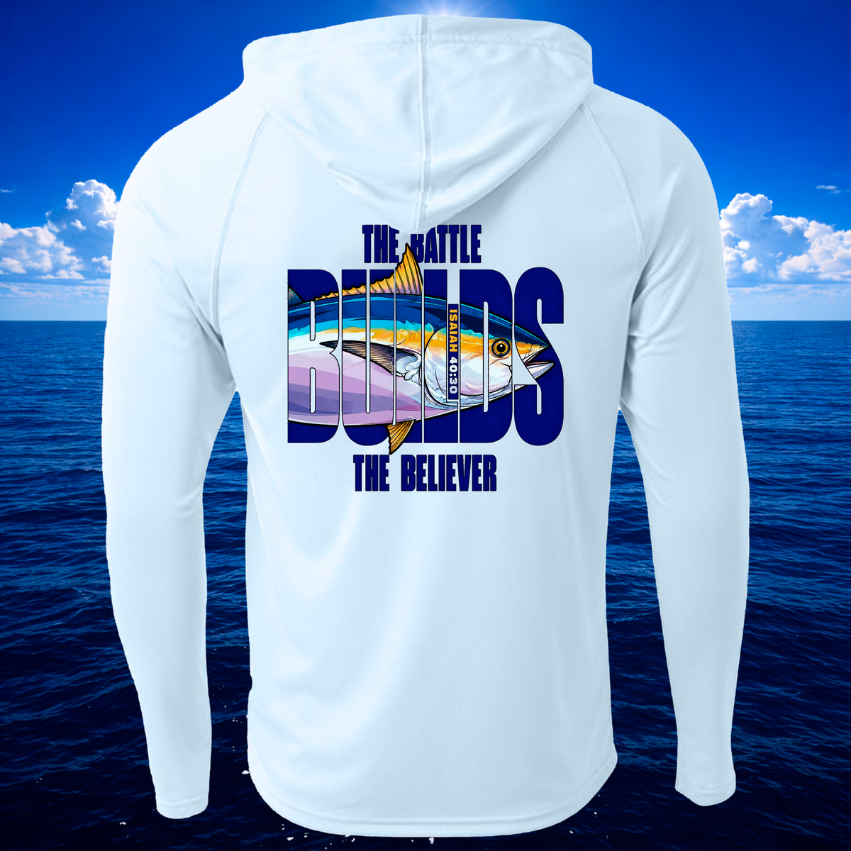 A Pastel Blue long-sleeve hooded shirt shown from the back, featuring a large graphic print with a tuna fish and the text 'THE BATTLE BUILDS THE BELIEVER' over a blue ocean and sky background.