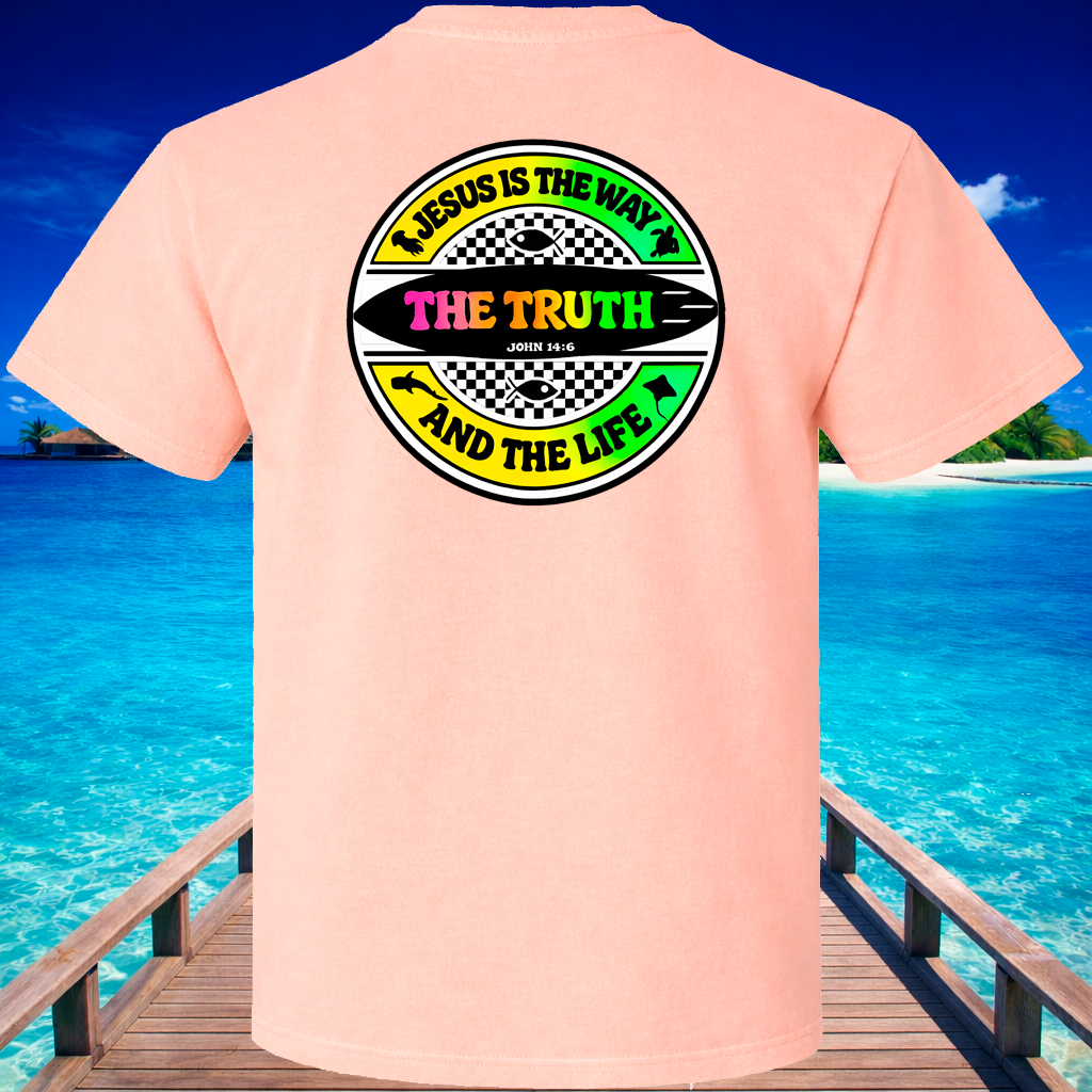 Pink t-shirt with a religious message graphic on the back, set against a tropical beach background.