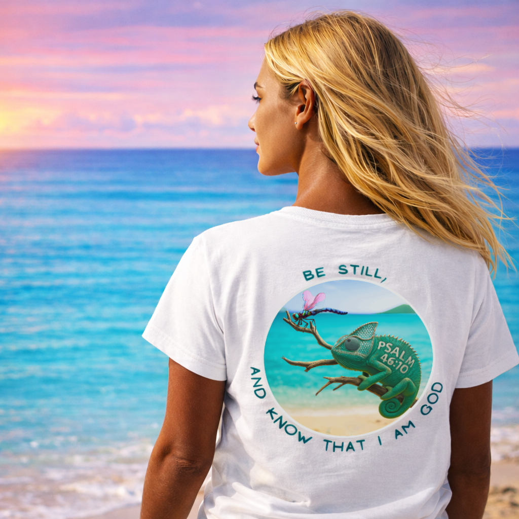 Woman wearing a white t-shirt with a nature graphic and text on a beach.
