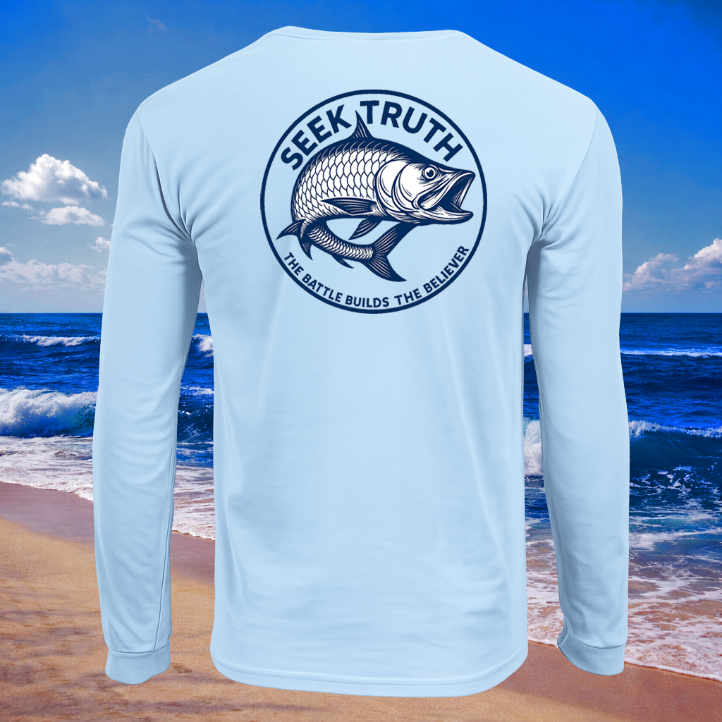 Light blue long-sleeve shirt with a Tarpon fish graphic and 'Seek Truth' text on a beach background