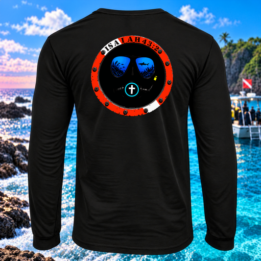 A black long-sleeve t-shirt shown from the back, featuring a large circular graphic print with a red outer ring, a black center, blue mirrored sunglasses, and the text 'ISALAH 43:23' along the top. The shirt is displayed against a vibrant beach and ocean background.