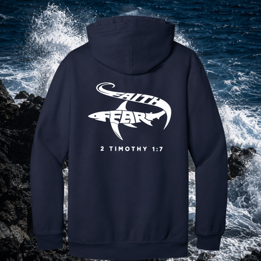Navy Seek Truth hoodie with 'Faith Over Fear' design and biblical verse on a rocky shoreline background