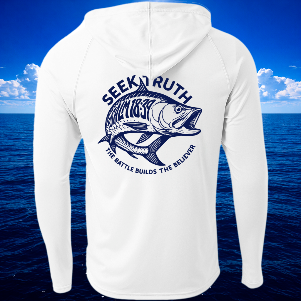 White long-sleeve hooded shirt shown from the back, featuring a large navy blue fish graphic and the words 'SEEK RUTH' and 'THE BATTLE BUILDS THE BELIEVER' over a blue ocean and sky background.