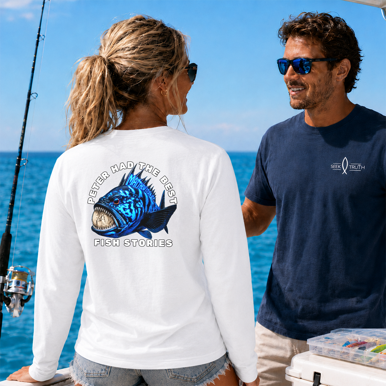 Two people on a boat with fishing gear, wearing shirts with fish-themed designs.