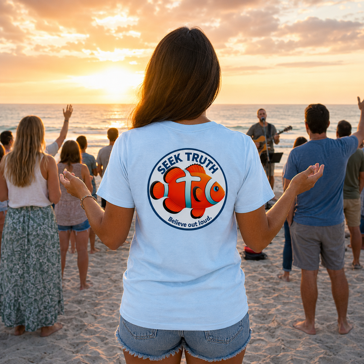 Person on a beach with 'Seek Truth' t-shirt at sunset