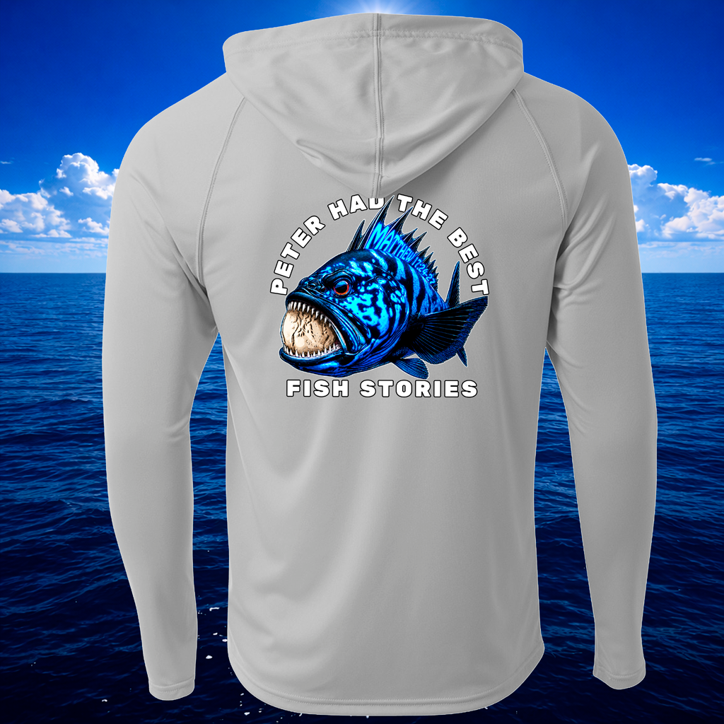 Gray hoodie with a fish graphic and text on the back, set against a blue ocean and sky background.